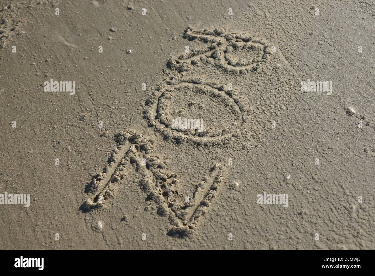 name written engraved into the sand tropical beach Stock Photo