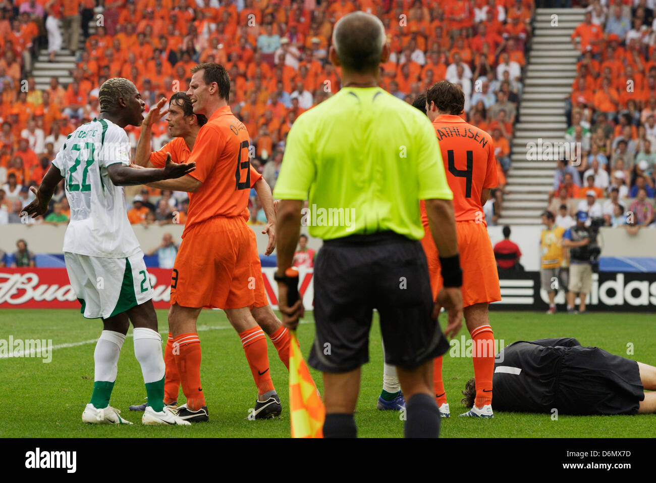 Romaric of Ivory Coast (22) argues with Andre Ooijer of Holland (13) during a FIFA World Cup Group C match at Mercedes-Benz Arena on June 16, 2006 in Stuttgart, Germany. Editorial use only. No pushing to mobile device usage. Commercial use prohibited. (Photograph by Jonathan Paul Larsen / Diadem Images) Stock Photo