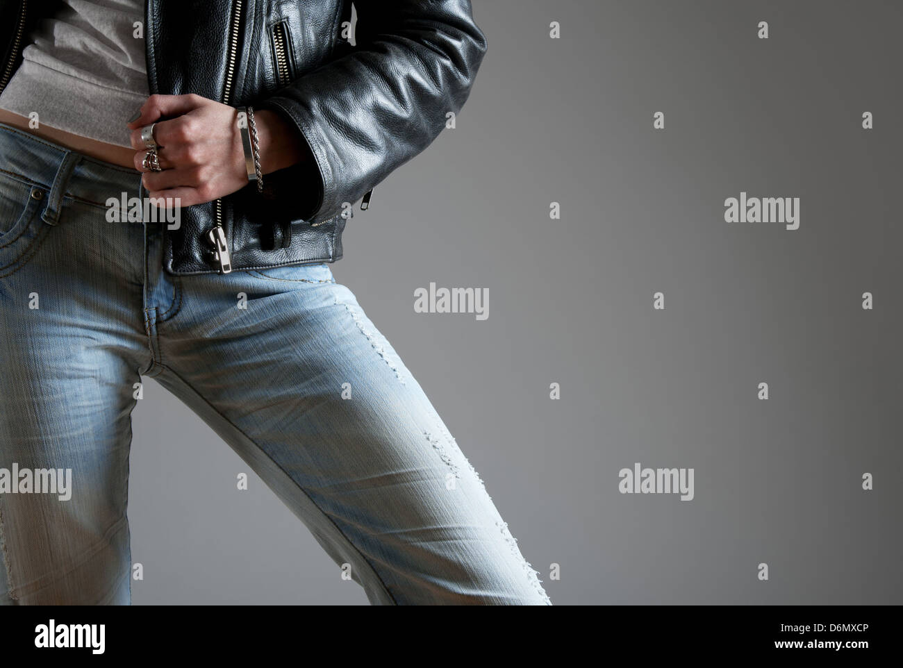 Young woman wearing jeans and black leather jacket. Stock Photo
