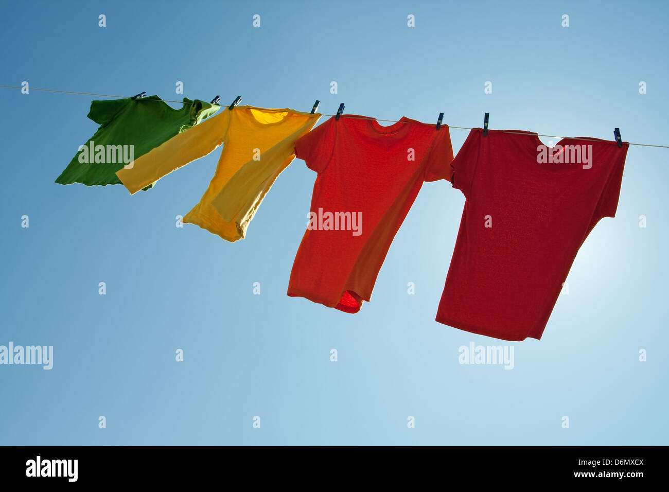 Clothes drying in the wind on a clothes line hires stock photography