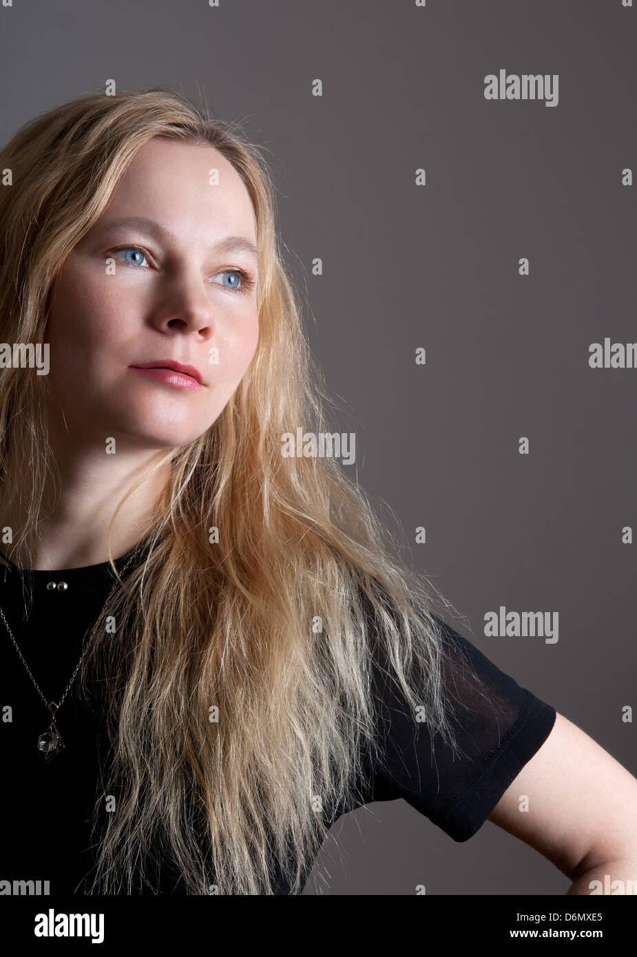 Portrait of a young woman with blue eyes and long hair Stock Photo - Alamy