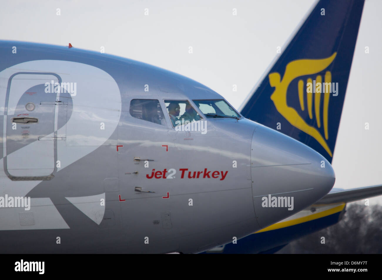 Jet2 and Ryan Air passenger planes about to depart Leeds Bradford Airport Stock Photo