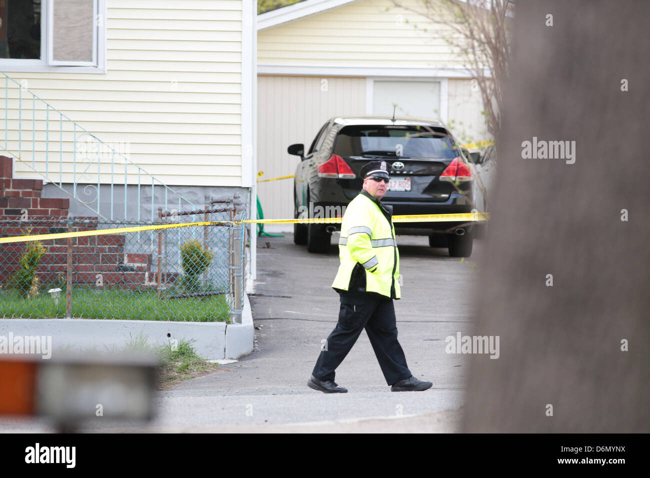 Watertown, Massachusetts, USA. 20th April, 2013. The scene surrounding 67 Franklin Street in Watertown, Massachusetts where bombing suspect Dzhokhar A. Tsarnaev was captured hiding inside a boat in the backyard is filled with Law Enforcement, Amercian flags on Saturday, April 20, 2013. (Credit Image: Credit:  Nicolaus Czarnecki/ZUMAPRESS.com/Alamy Live News) Stock Photo