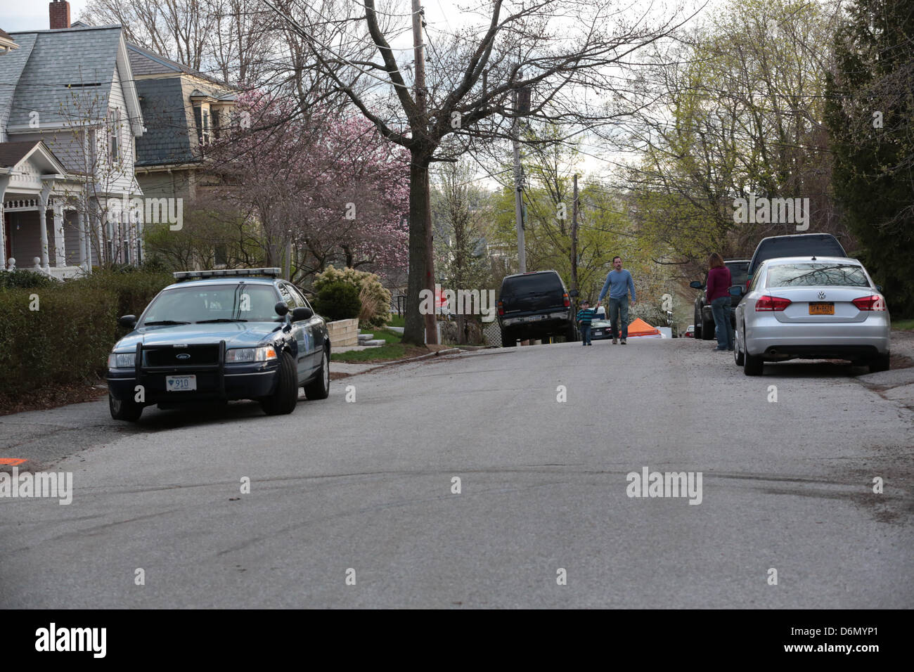 Watertown, Massachusetts, USA. 20th April, 2013. The scene surrounding 67 Franklin Street in Watertown, Massachusetts where bombing suspect Dzhokhar A. Tsarnaev was captured hiding inside a boat in the backyard is filled with Law Enforcement, Amercian flags on Saturday, April 20, 2013. (Credit Image: Credit:  Nicolaus Czarnecki/ZUMAPRESS.com/Alamy Live News) Stock Photo