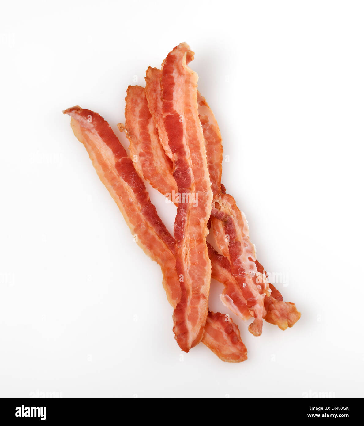 Frying pan with cooked bacon rashers on white background Stock Photo - Alamy