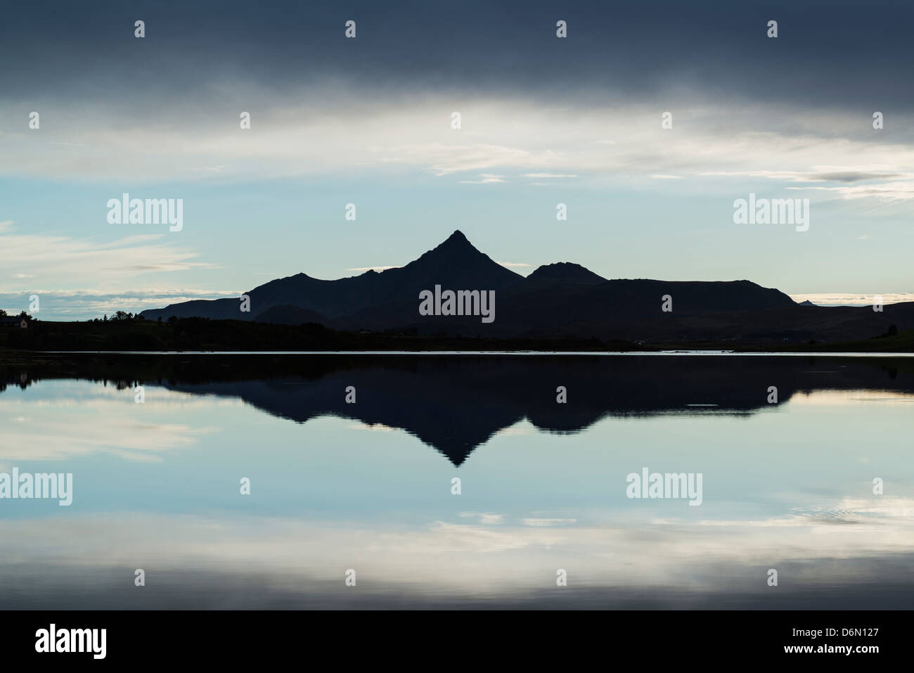 Reflection of Skottinden mountain peak in Lake, Vestvågøya, Lofoten Islands, Norway Stock Photo