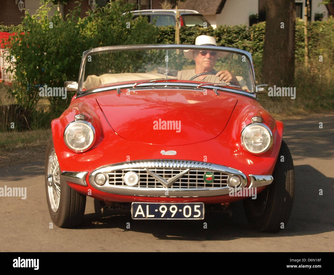 The 1960 Daimler SP 250 is a British sports car known for its sleek design and high performance. Equipped with a 2.5L V8 engine, it was capable of fast speeds and agile handling. The car remains a sought-after model among collectors for its stylish appearance and engineering. Stock Photo