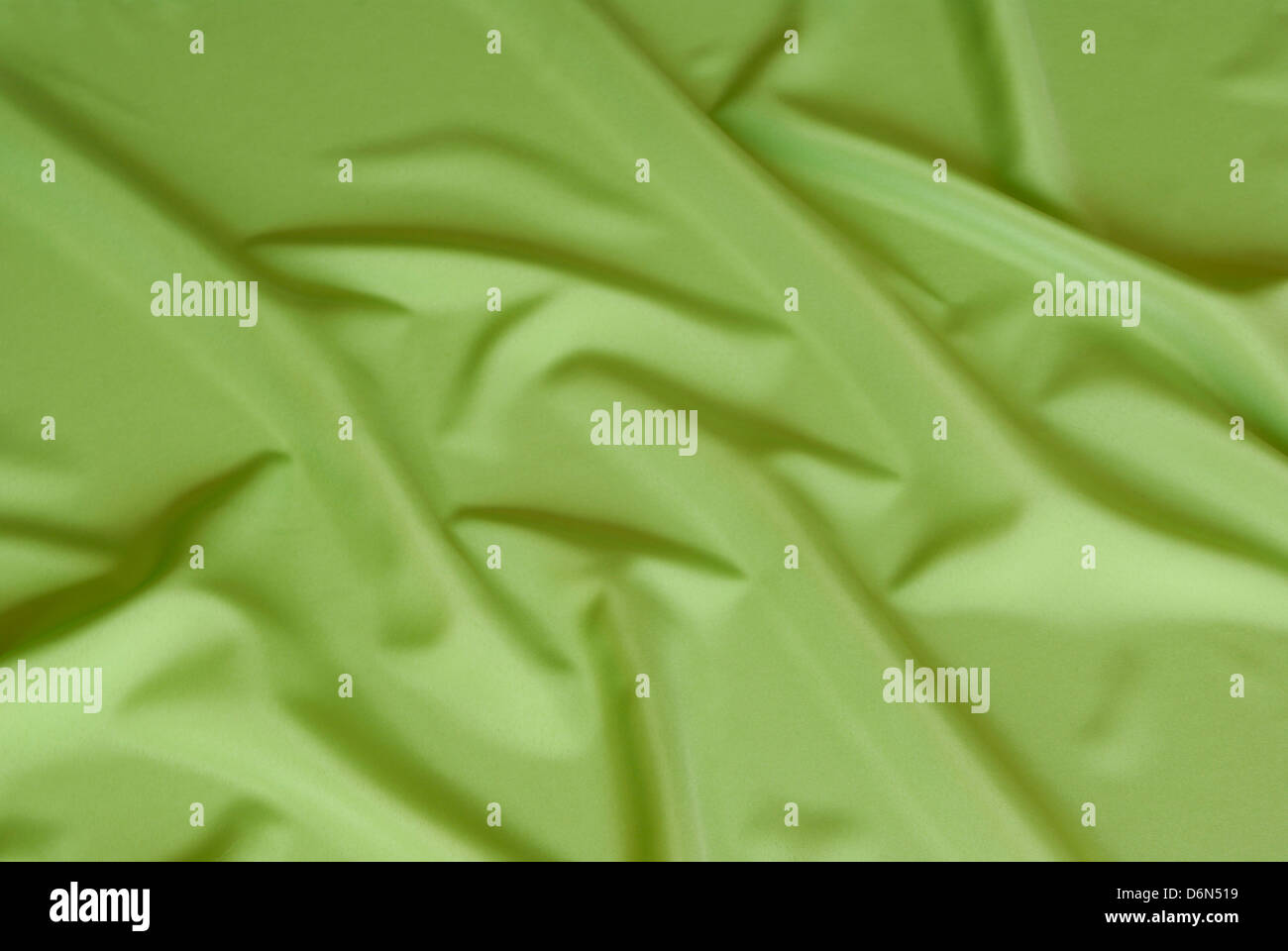 arranged green and silky cloth as background Stock Photo