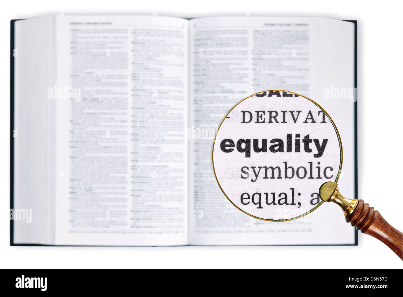 A magnifying glass held over a dictionary looking at the word Equality enlarged Stock Photo