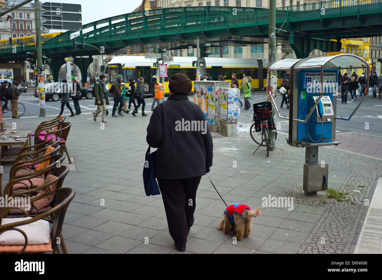 Berlin, Germany, a woman with her dog on the Eberswalderstrasse Stock Photo