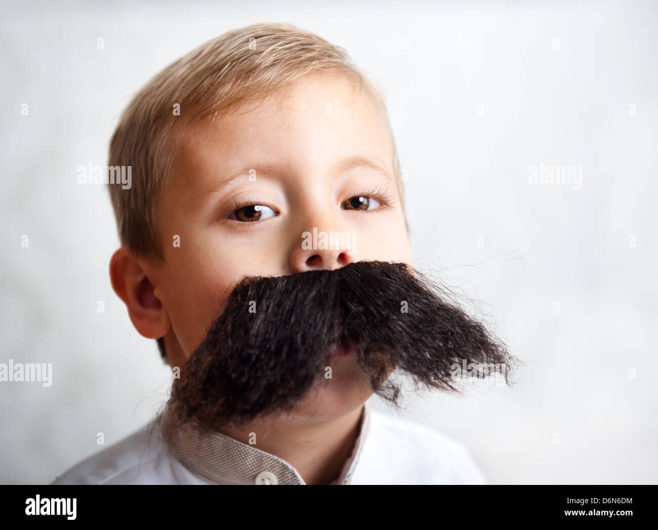 The little boy with a big mustache Stock Photo
