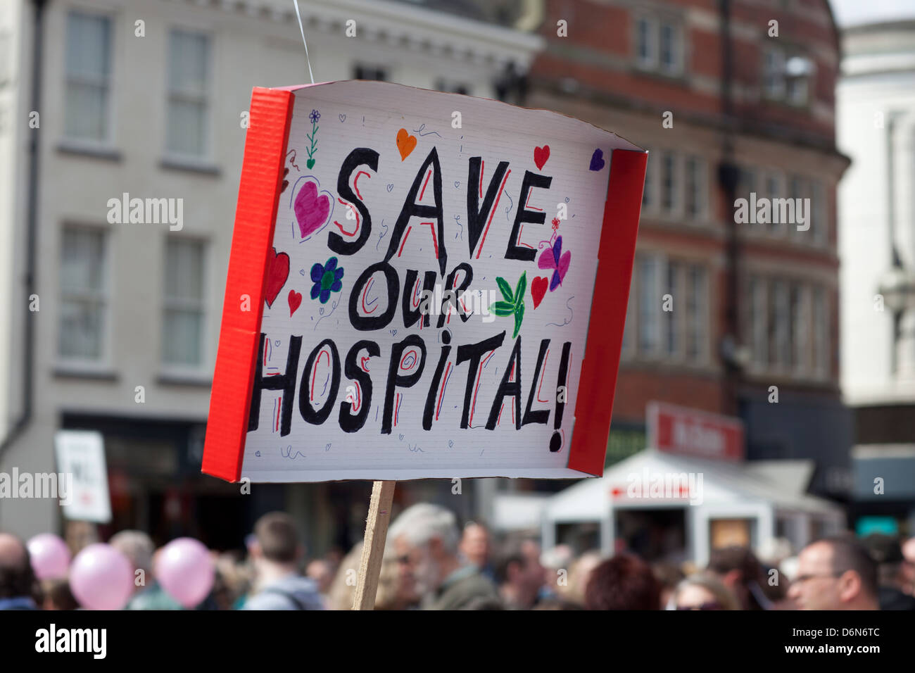 Protesters march through Stafford against cuts to NHS services at Stafford Hospital Stock Photo