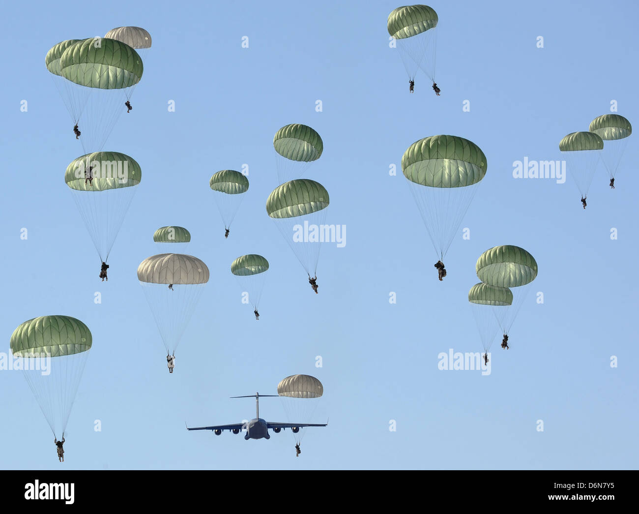 US Army paratrooper soldiers parachute during an airdrop exercise April