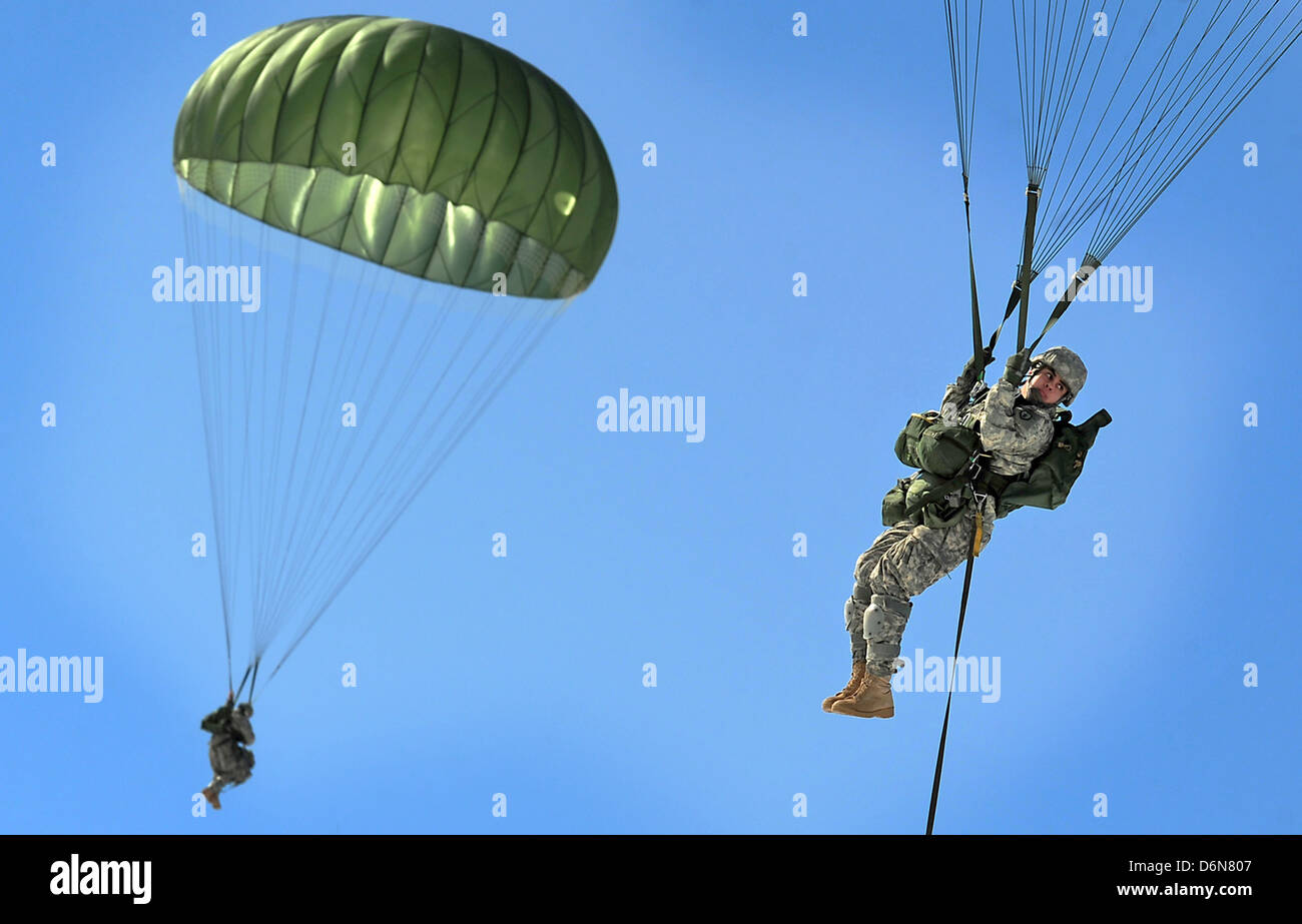 US Army paratrooper soldiers parachute during an airdrop exercise April