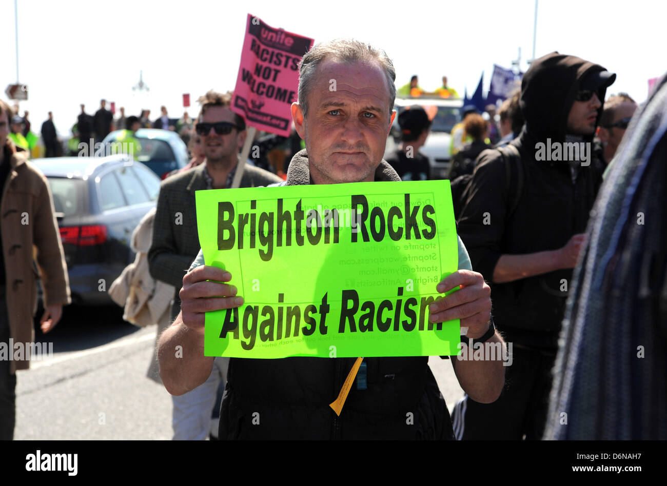 Brighton Sussex UK 21st April 2013 - Anti Fascists try to disrupt a March for England procession along Brighton seafront today . The parade was heavily policed as they tried to keep the two groups apart Photograph taken by Simon Dack/Alamy Live News Stock Photo