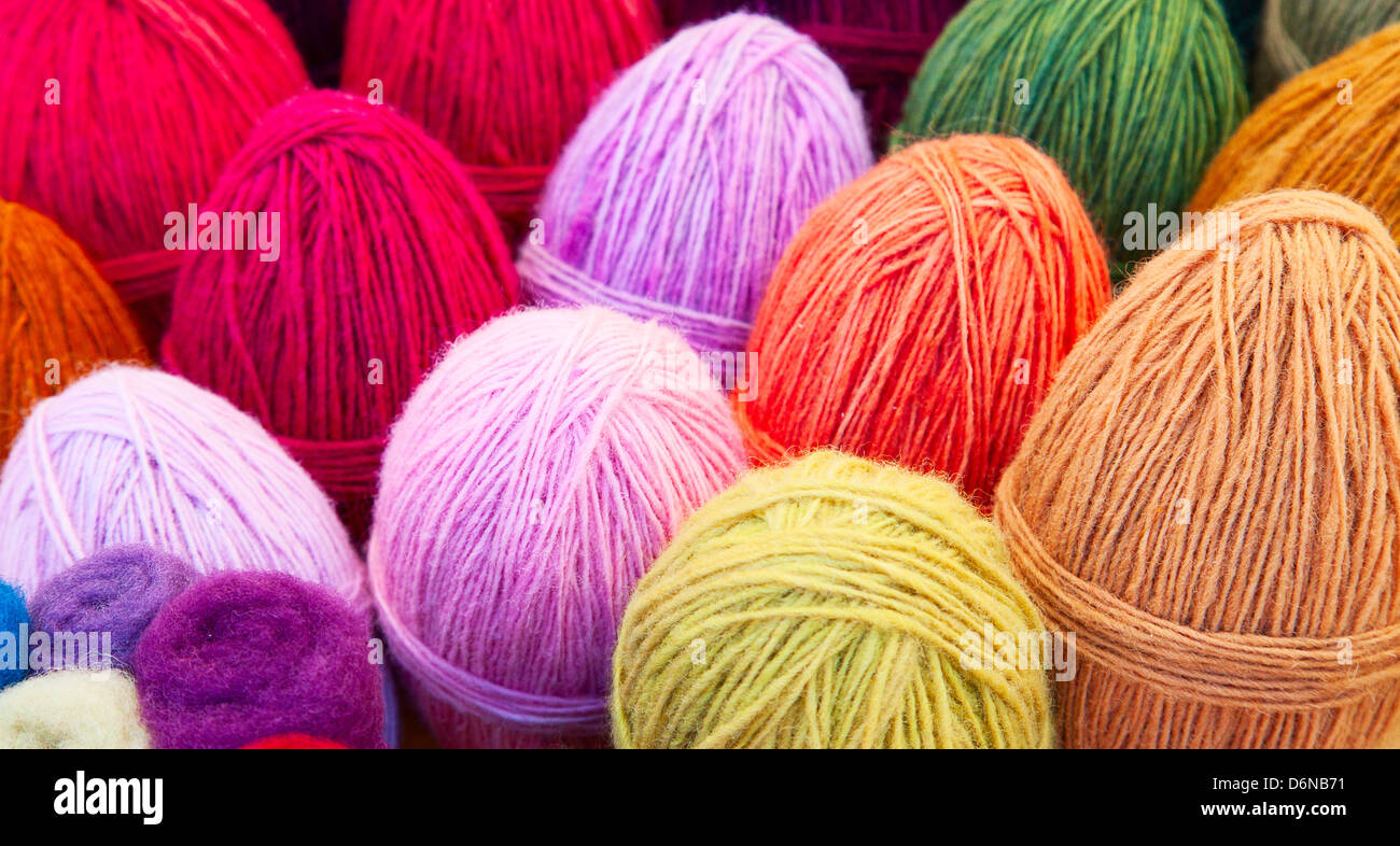 Colourful wool yarn with crocheting needles. Resolution and high