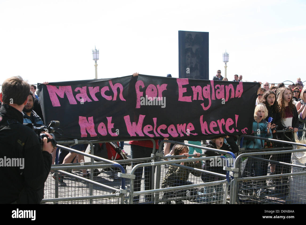 London, UK. 21st April, 2013.  Anti-facist protesters along beachfront opposing EDL supporters take part in a 'March for England' in Brighton    Credit:  Mario Mitsis / Alamy Live News Stock Photo