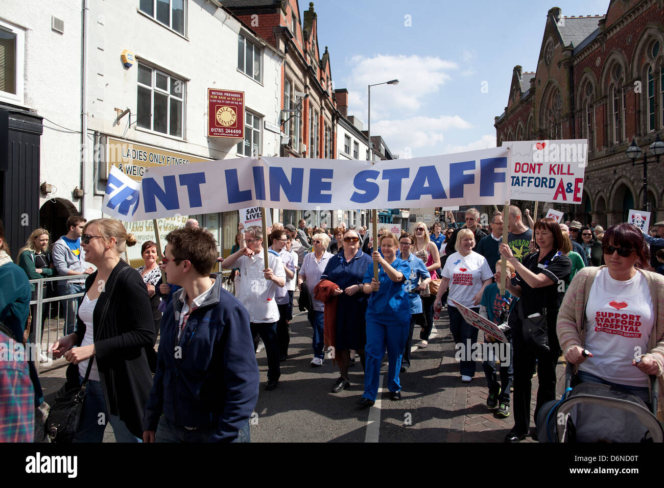 Protesters march through Stafford against cuts to NHS services at Stafford Hospital Stock Photo