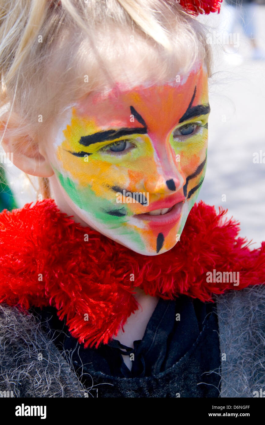 Girl age 12 with artistically painted cat face. MayDay Parade and Festival Minneapolis Minnesota MN USA Stock Photo