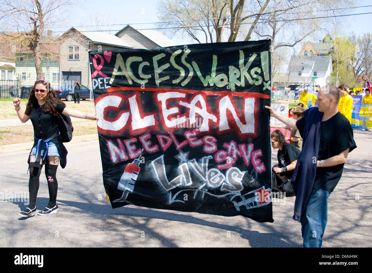 Banner advocating the use of clean needles to save lives. MayDay Parade and Festival Minneapolis Minnesota MN USA Stock Photo
