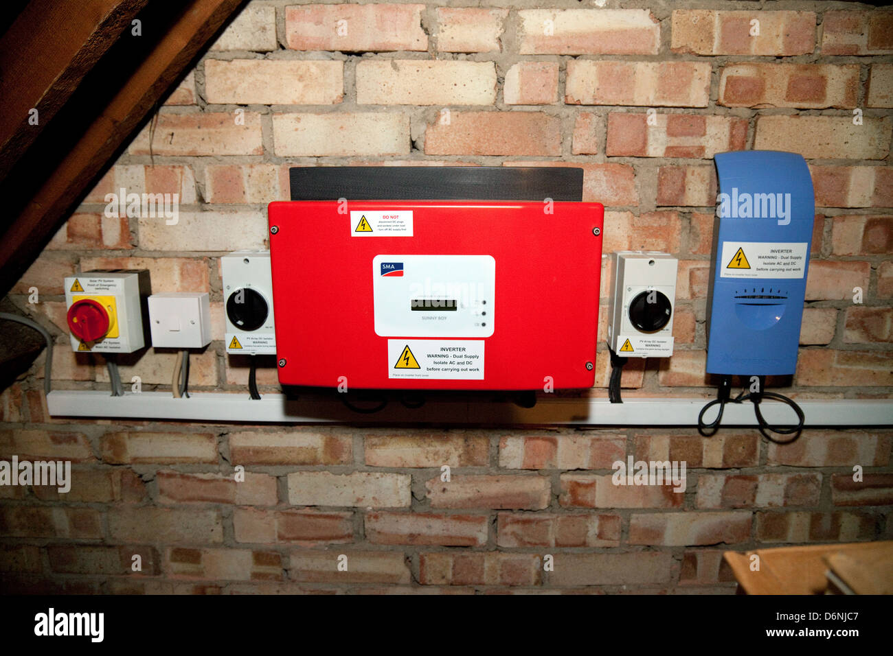 The inverter inverters and electric supply  in a solar panel set up in a domestic attic, UK Stock Photo