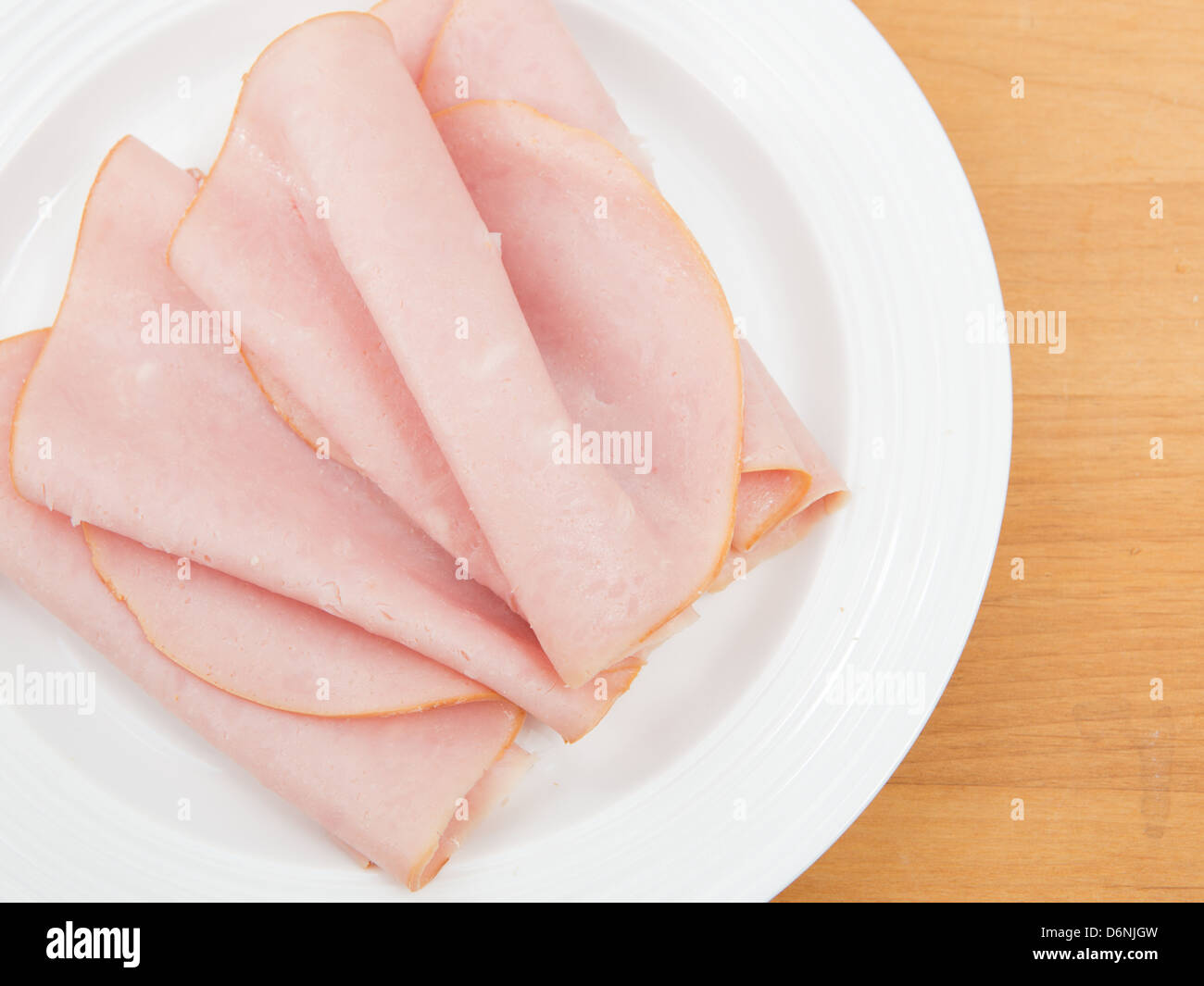 Plate of thinly sliced deli ham Stock Photo