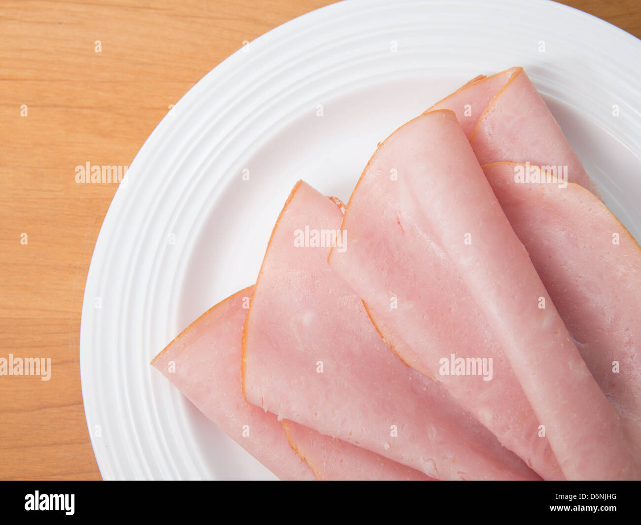 Plate of thinly sliced deli ham Stock Photo