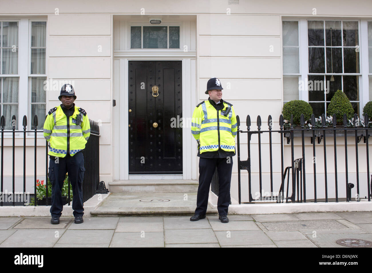 Two policemen outside Maggie Thatcher's house Stock Photo