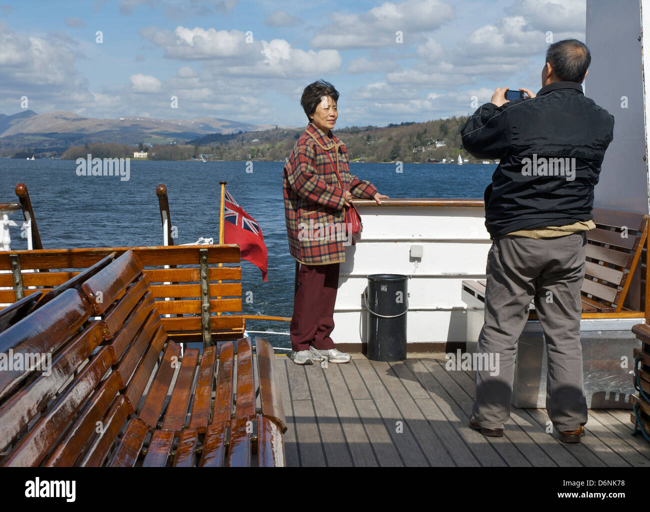 Asian couple on Lake Windermere passenger steamer, Lake District National Park, Cumbria, England UK Stock Photo