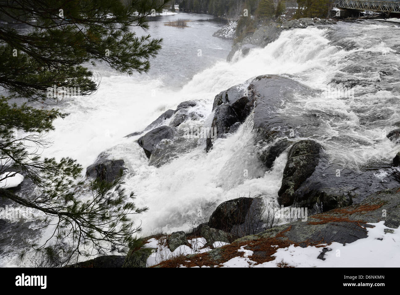 High Falls on the swollen north Muskoka River near Bracebridge in Spring Stock Photo