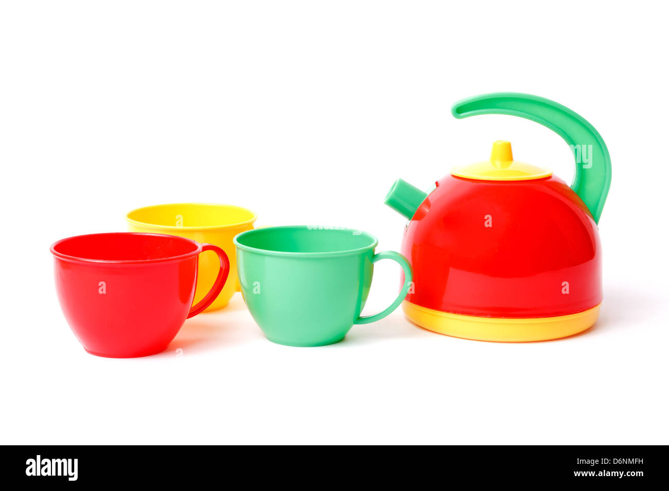teapot and three cups toys isolated on white Stock Photo