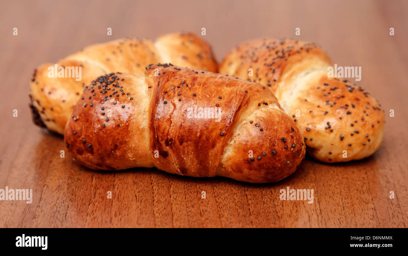 three appetizing Poppy Seed Buns Stock Photo