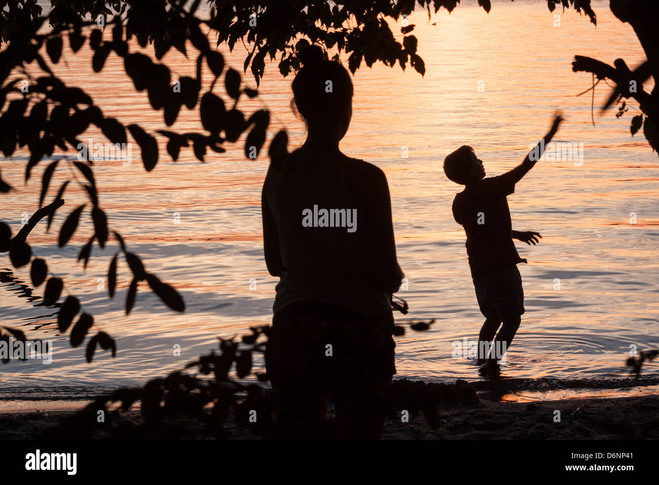 Berlin, Germany, a mother and her son on the Havel River at sunset Stock Photo