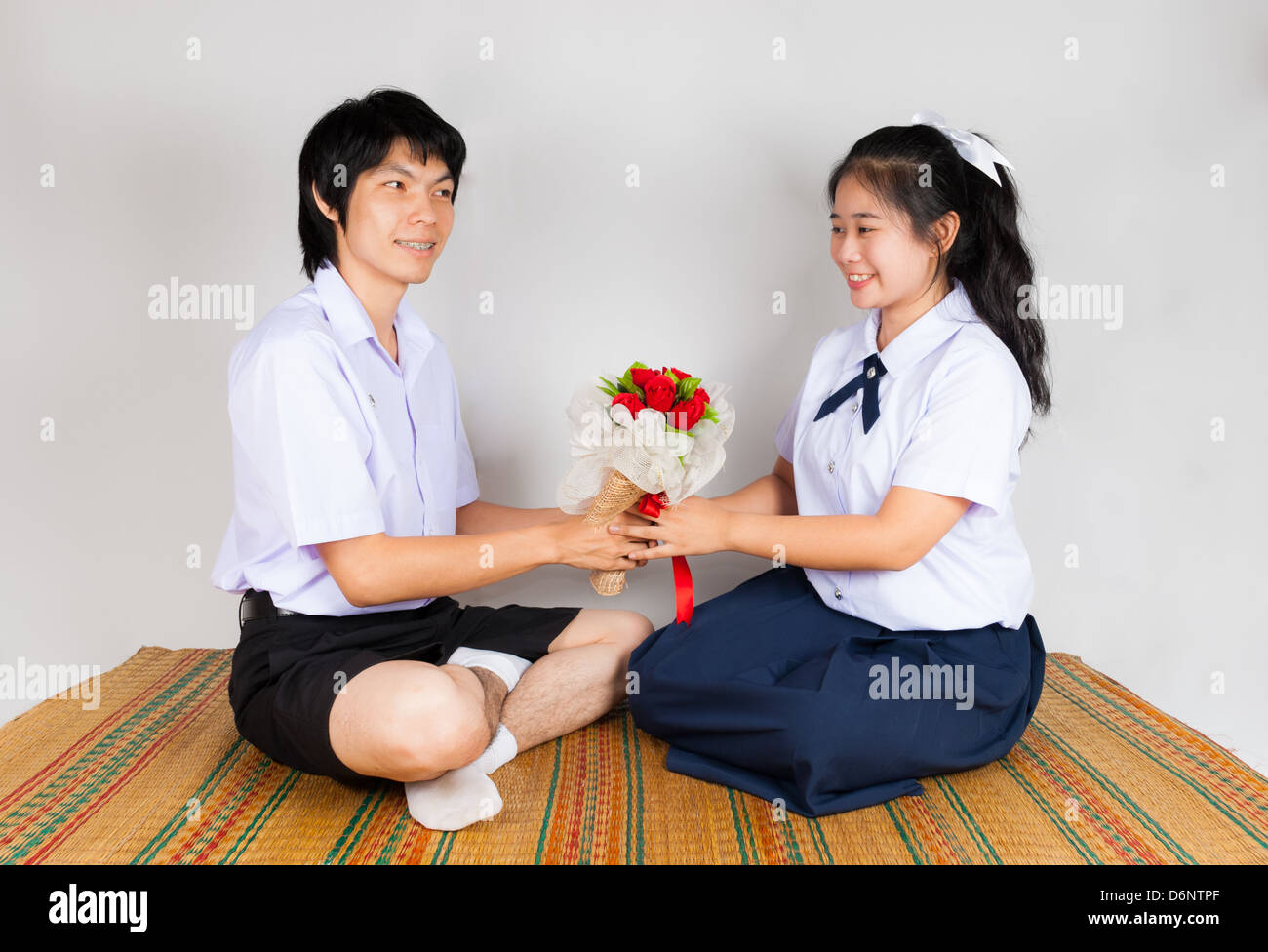Boyfriend gives flower to girlfriend Stock Photo