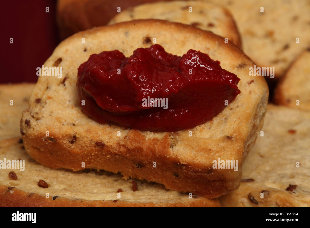 Traditional greek rusk with tomato paste Stock Photo - Alamy