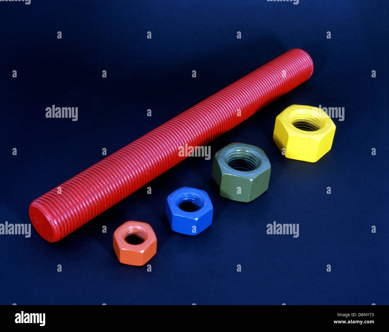 Large coloured nuts and bolts, England, UK, Western Europe Stock Photo