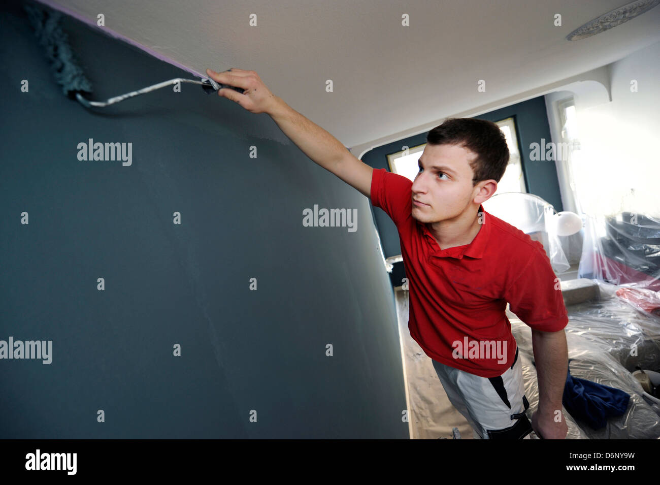 Professional painter during his work. Stock Photo