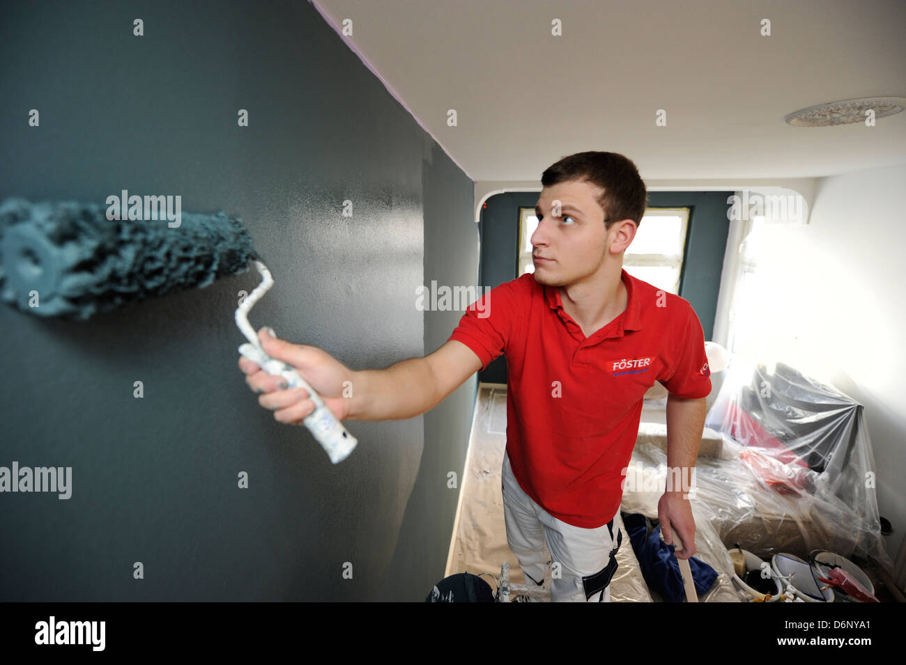 Professional painter during his work. Stock Photo