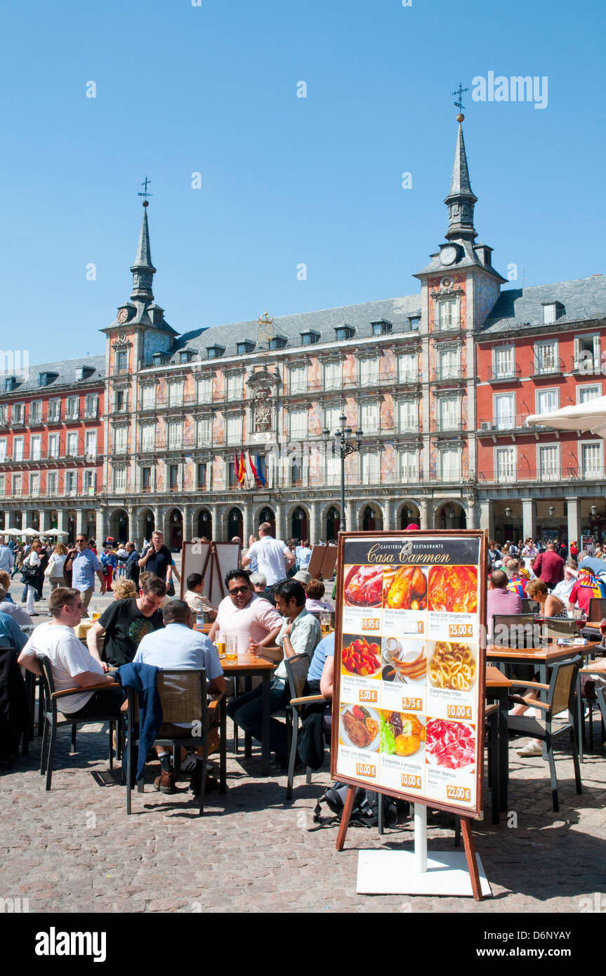 People sitting on terraces at the Main Square. Madrid, Spain. Stock Photo