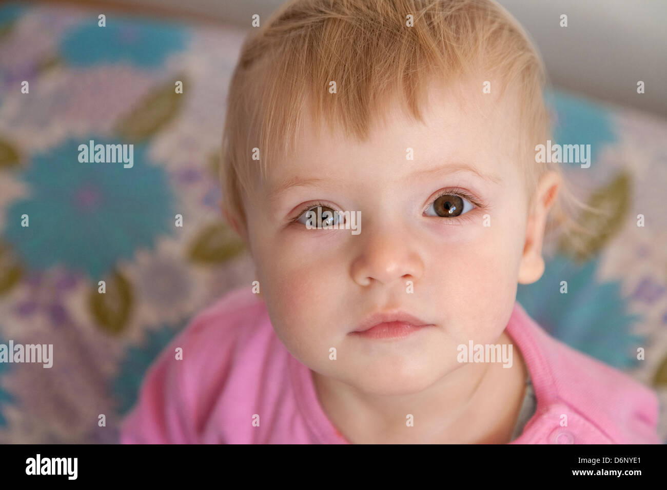 baby girl looking upwards, closeup, vertical frame Stock Photo Alamy