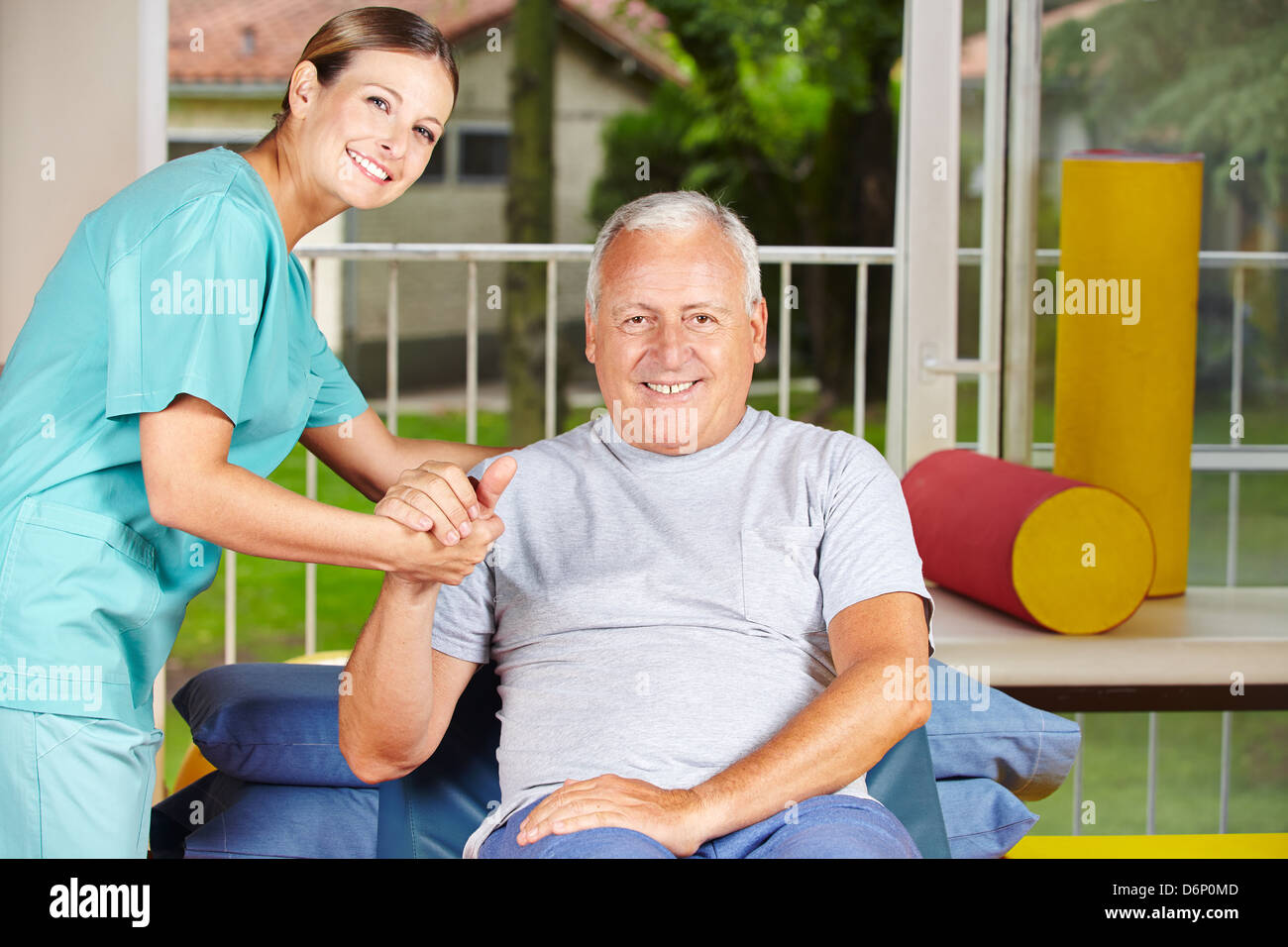 Senior man getting physiotherapy with a physiotherapist Stock Photo