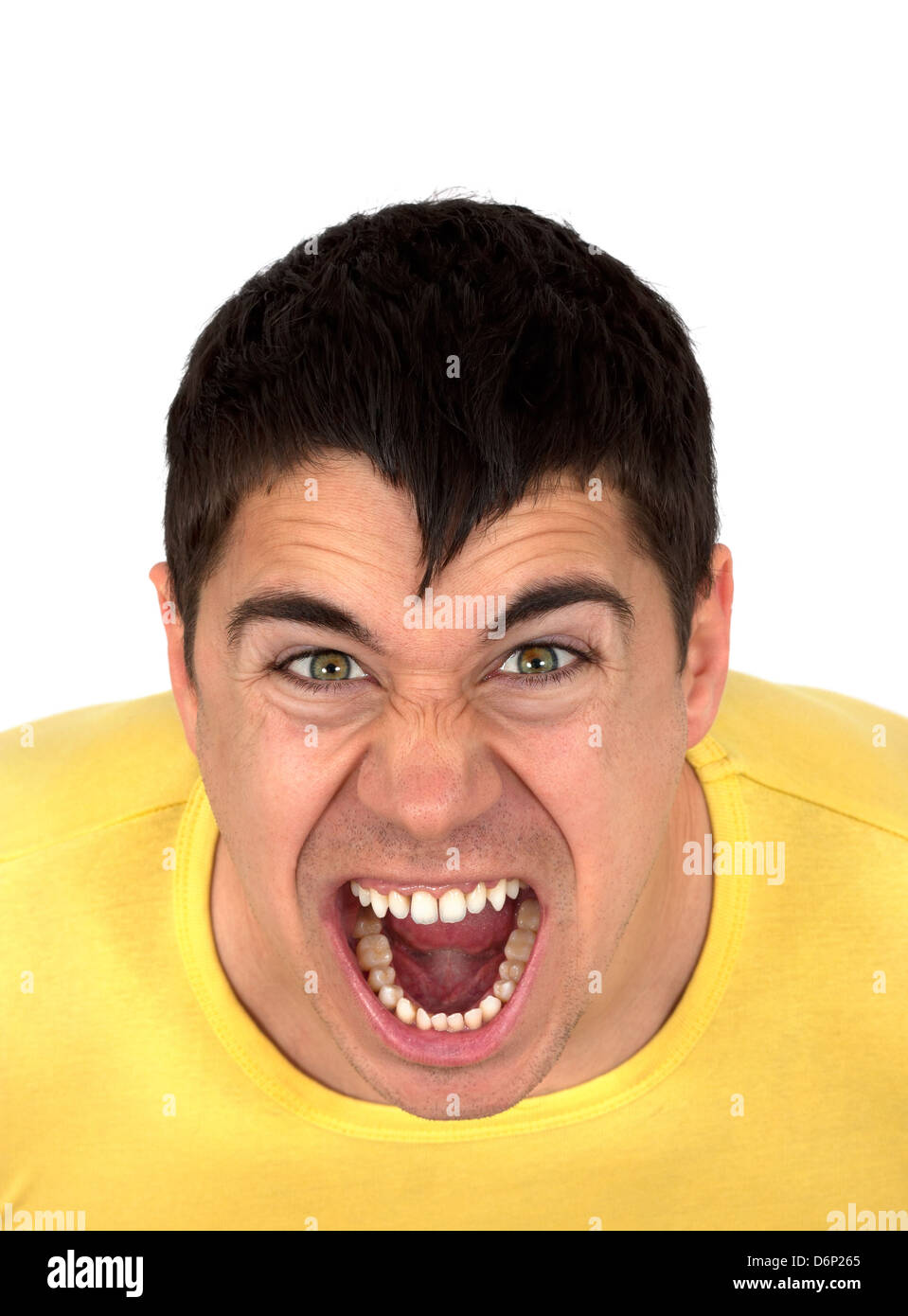 Young athletic muscular man shouting or yelling with fury.Isolated on white background.Agression concept Stock Photo
