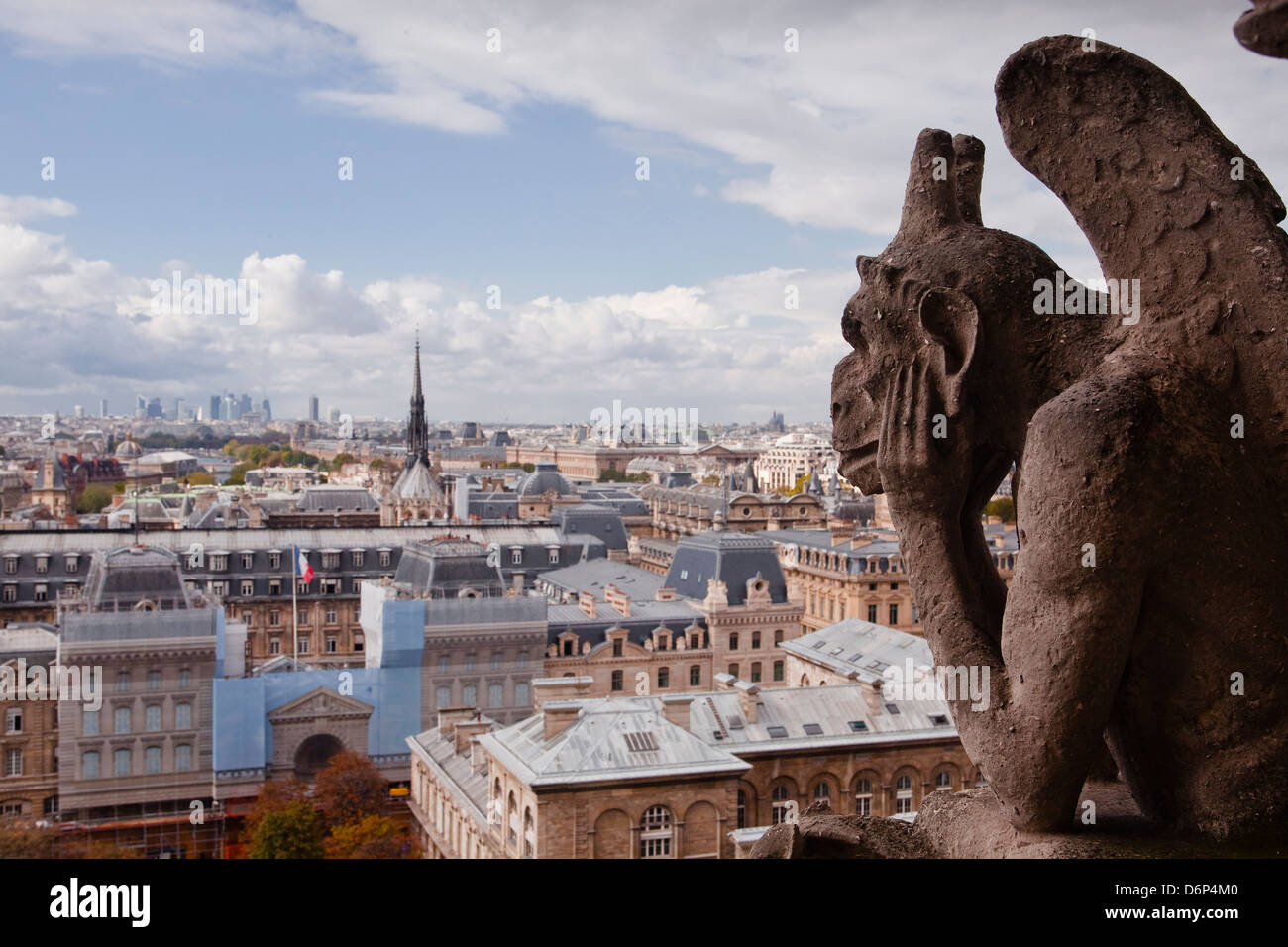 A gargoyle stares out from Notre Dame de Paris cathedral, Paris, France, Europe Stock Photo