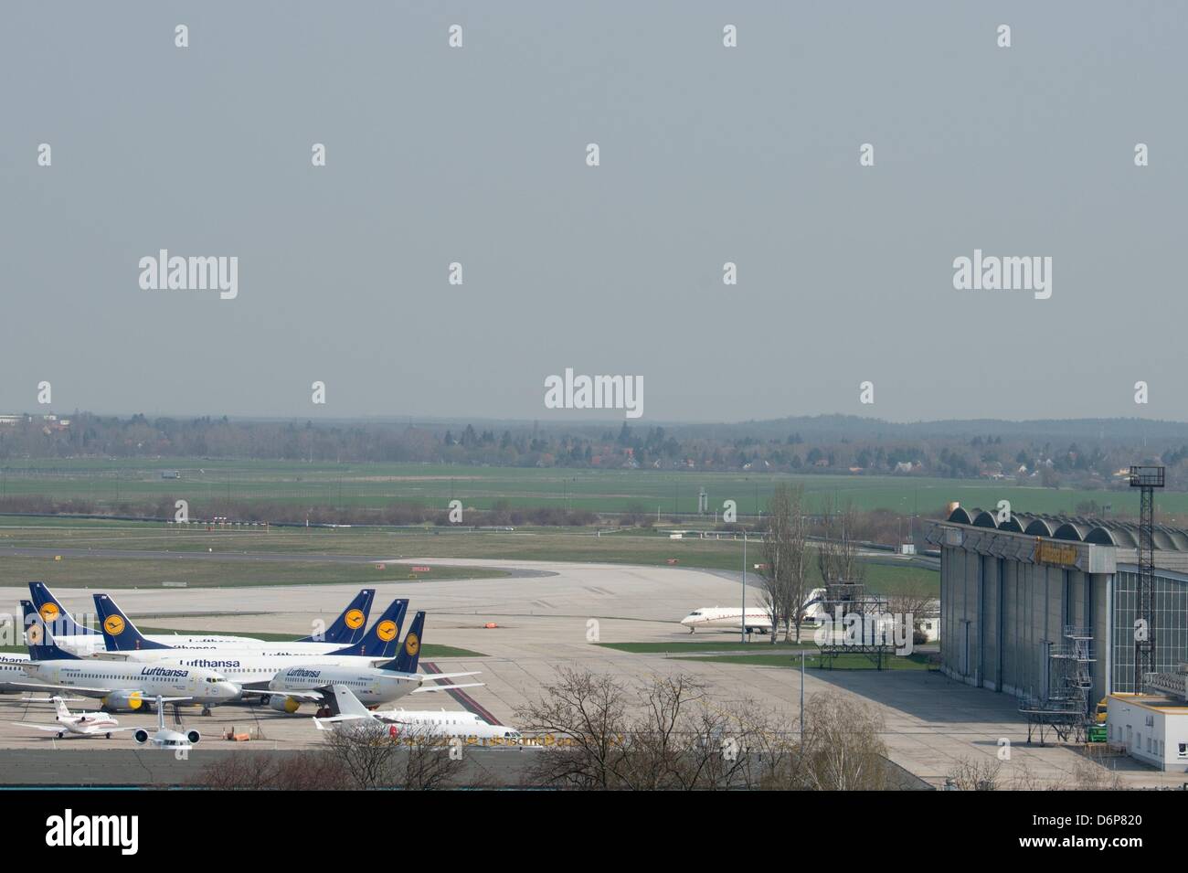 Air planes of the airline Lufthansa park on the runway of the airport in Schoenefeld, Germany, 22 April 2013. It is the second round of strikes, initiated as reaction to an ongoing collective bargaining and negotiations on labor conditions of about 33.000 technicians and flight attendants. Photo: Marc Tirl Stock Photo