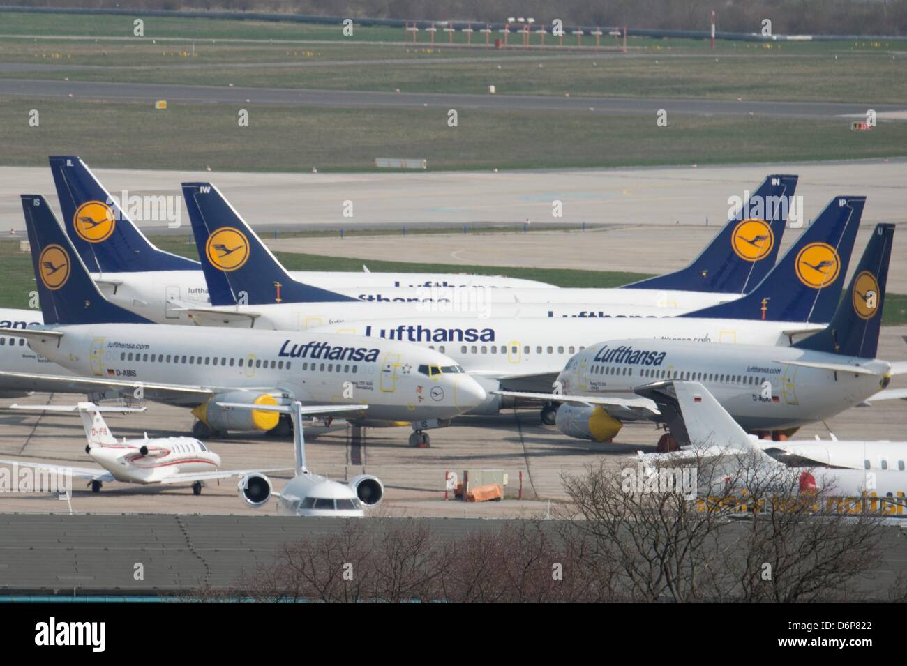 Air planes of the airline Lufthansa park on the runway of the airport in Schoenefeld, Germany, 22 April 2013. It is the second round of strikes, initiated as reaction to an ongoing collective bargaining and negotiations on labor conditions of about 33.000 technicians and flight attendants. Photo: Marc Tirl Stock Photo