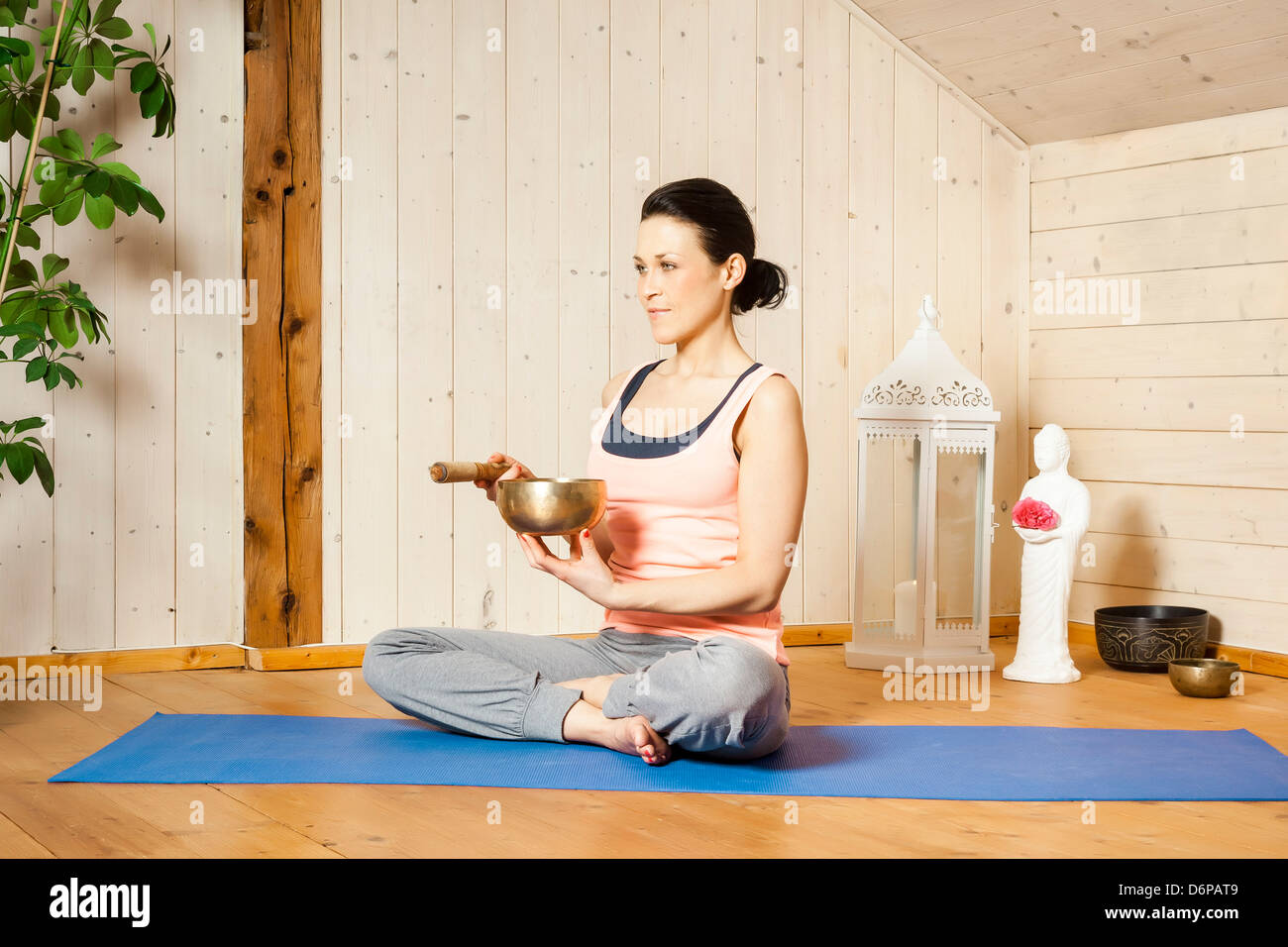 An image of a pretty woman doing yoga at home Stock Photo - Alamy