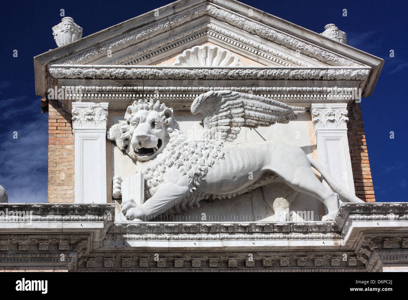 The winged Venetian lion at the Entrance 'Porta Magna' of Arsenale, Venice, Italy - Venezia, Italia - Venedig, Italien Stock Photo