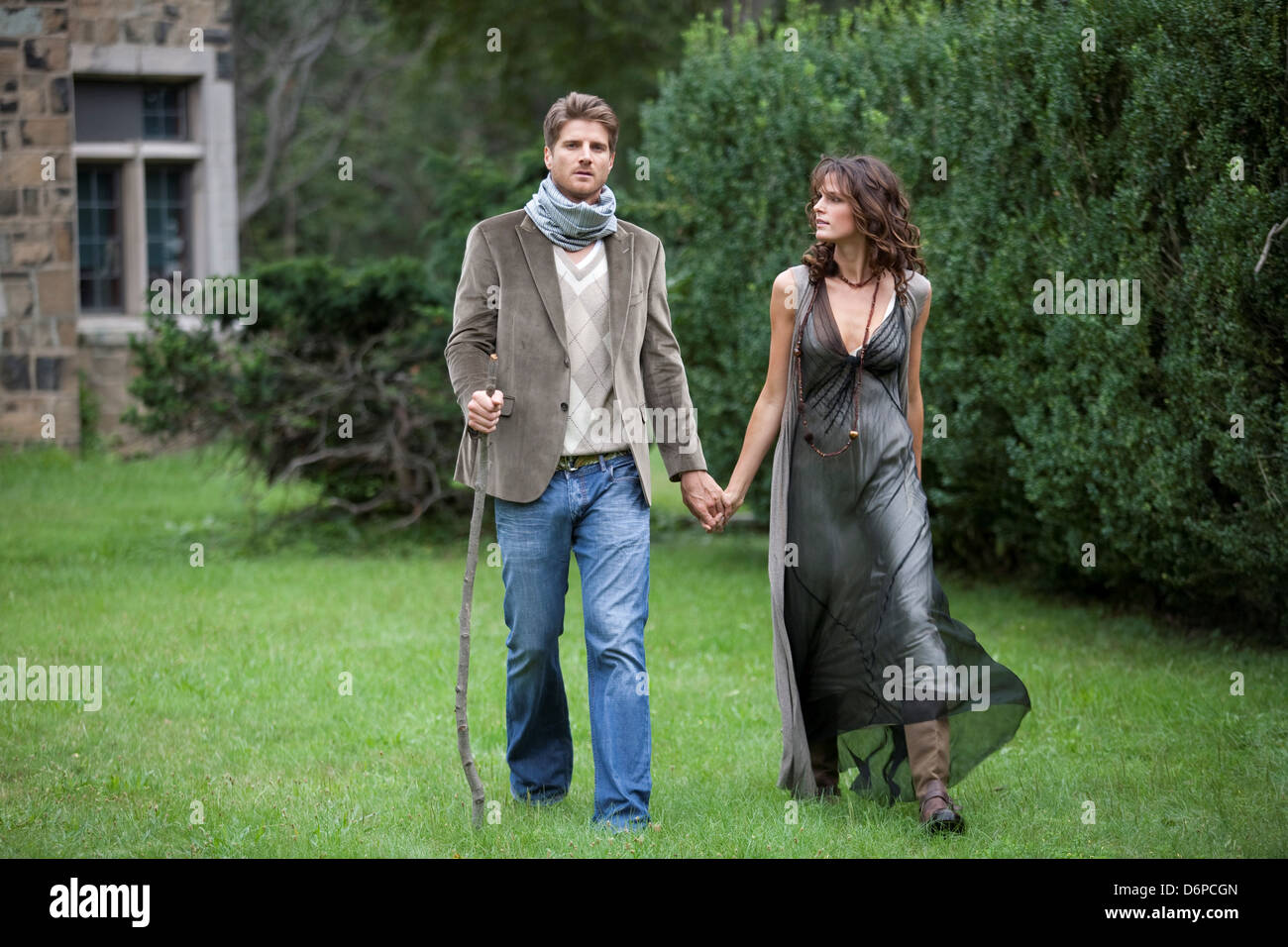 Young couple walking in park Stock Photo - Alamy