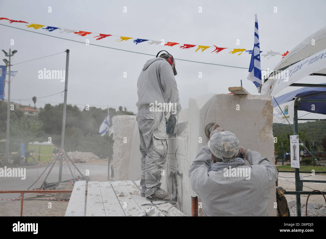 Sculpturing in Stone. Artist forming a large limestone Photographed in