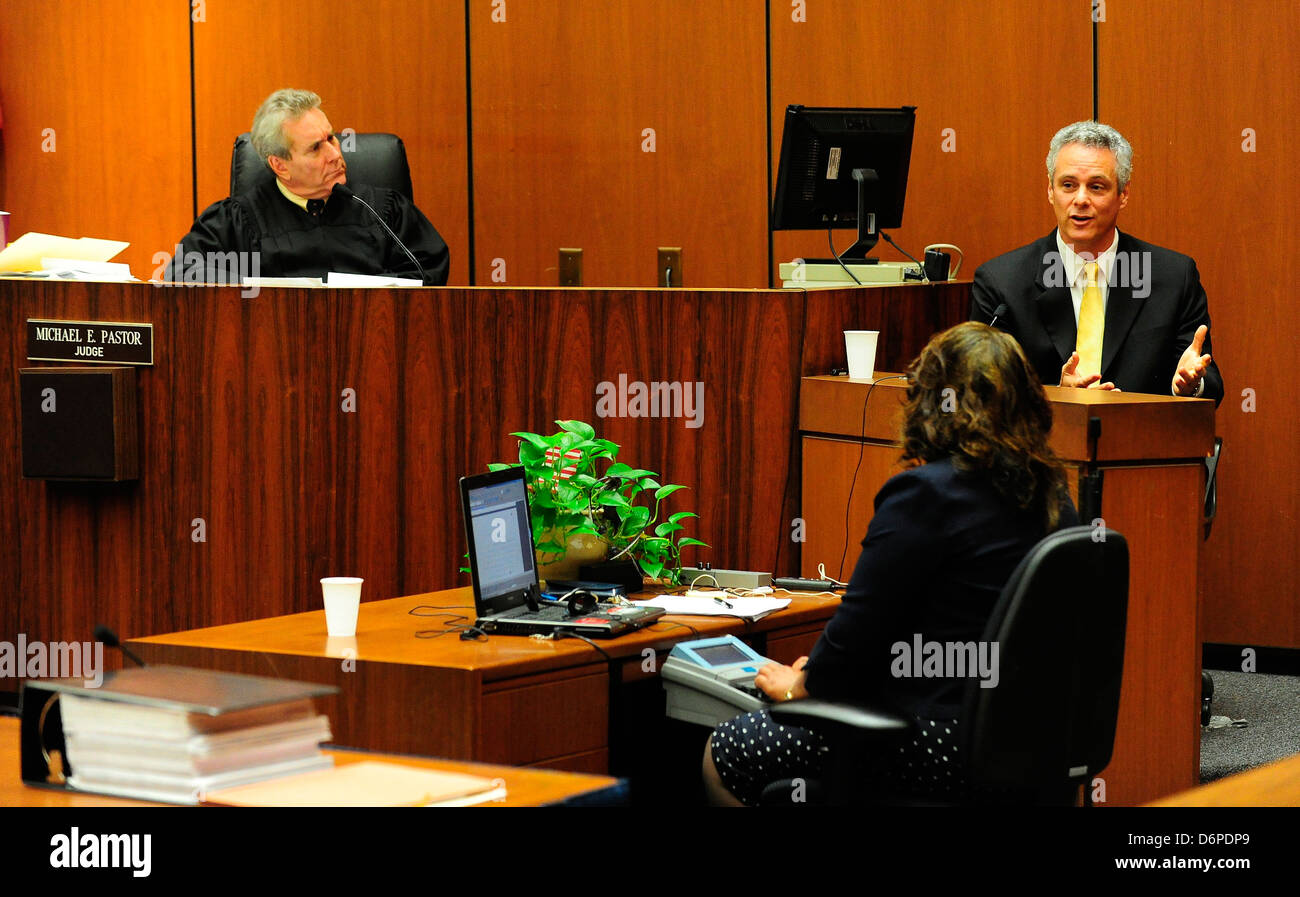 Judge Michael E. Pastor (L) listens as Dr. Alon Steinberg speaks from ...